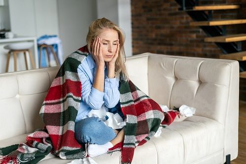 Woman with flu symptoms